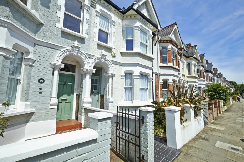 London street of early 20th century Edwardian terraced houses in a sunny day